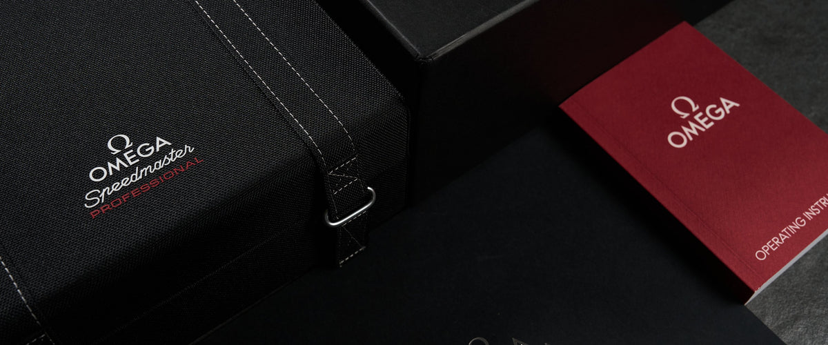 Omega presentation box with red booklet